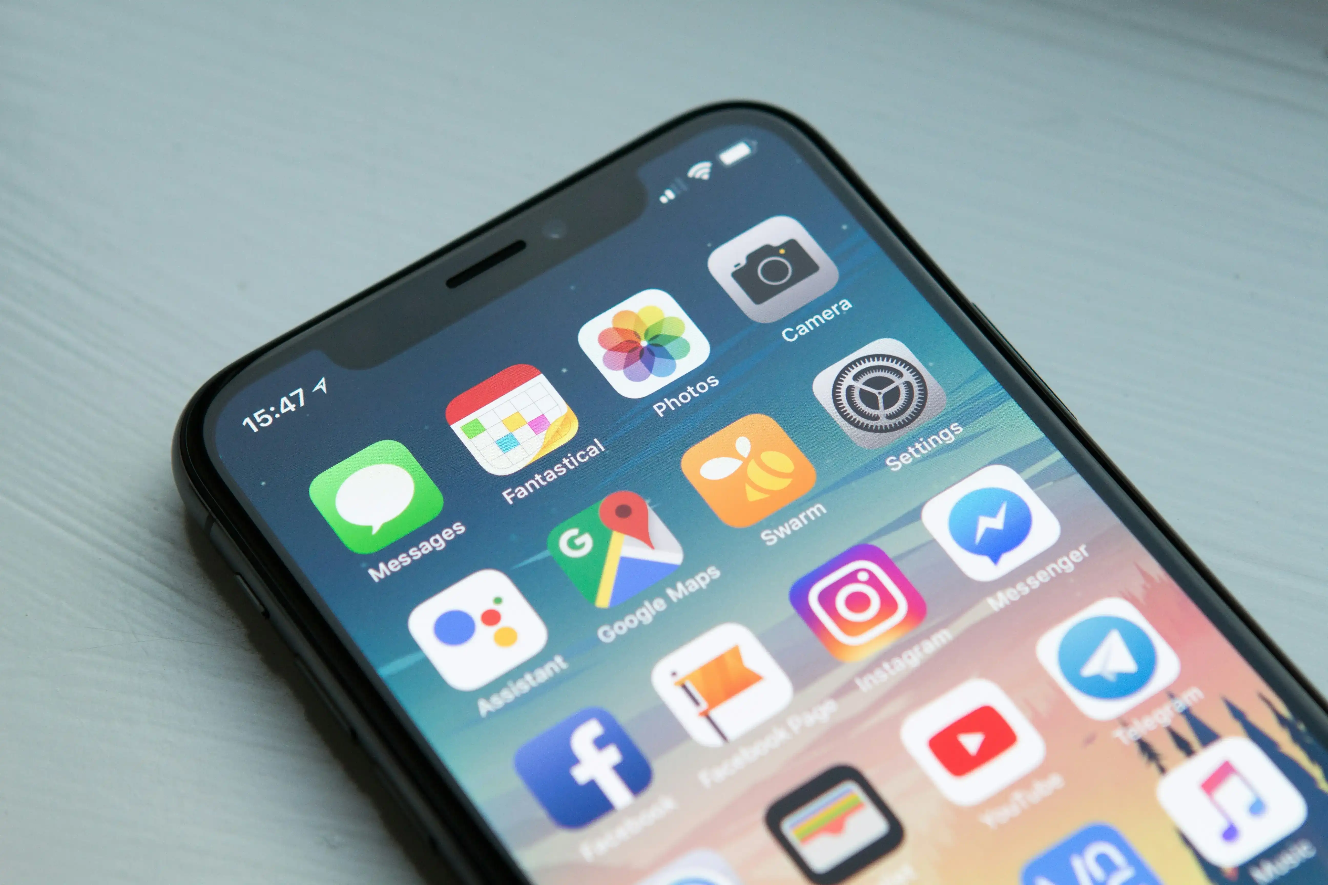 Mobile device displaying Google Mobile-Friendly Test results with page preview, usability issues, and mobile rendering analysis